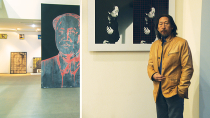 Wang Guangyi in his Beijing studio speaking with Andrew Cohen in front of recent works. Stills from video shot by Julien Roby.