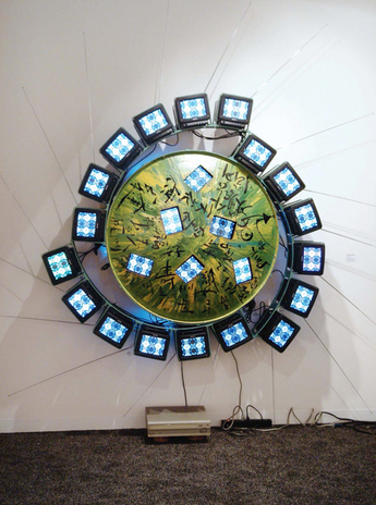 NAM JUNE PAIK, Venus, 1990, painted aluminum infrastructure, one multi-painted satellite dish, 24 Sony 8" color TV sets, one disk player, 193 × 193 × 48.3 cm. Courtesy Galerie Hans Mayer, Dusseldorf.