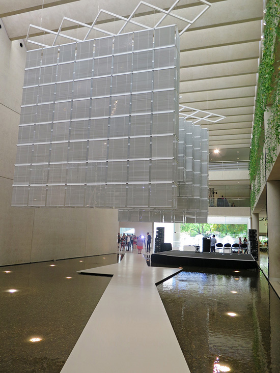 HAEGUE YANG, Sol LeWitt Upside Down – Open Modular Cubes (Small) Expanded 943 Times, 2015. In this  site-specific installation, several hundred venetian blinds occupy Queensland Art Gallery’s water-mall site. As the  light changes throughout the day, the configuration of the blinds take on different shapes. All photos by Michael Young  for ArtAsiaPacific.