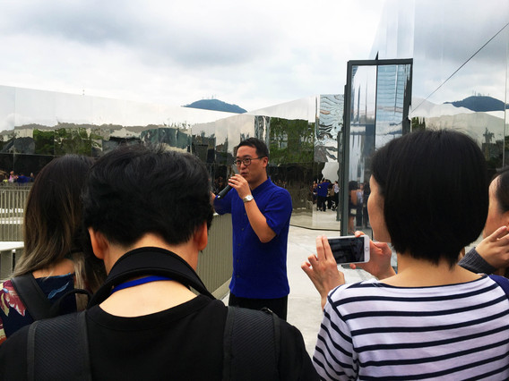 M+ deputy director and chief curator Doryun Chong introducing the external space of “Nothing.” A platform area of the museum that is usually open to the public has been closed off by the artist for the exhibition.