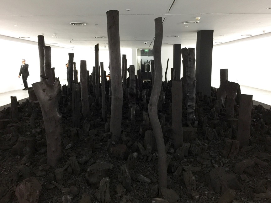 HAN SAI POR’s Black Forest (2016) overtakes a gallery at SAM with charred wooden logs scattered amongst a bed of charcoal, which speaks to the urgency of contemporary ecological concerns. All photos by Sylvia Tsai for ArtAsiaPacific.