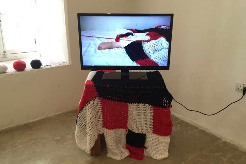 SOMAR SALLAM, Disillusioned Construction, 2016, wool, wool blanket, and crochet hooks, dimensions variable; video: 4 min 56 sec.