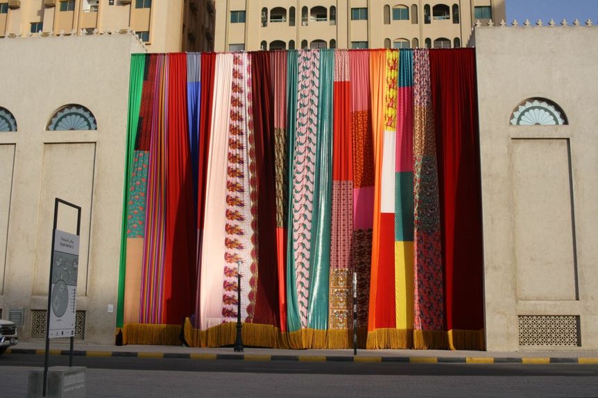 JOE NAMY, Libretto-o-o: A Curtain Design in the Bright Sunshine Heavy with Love, 2017, site-specific installation with curtains and sound, installed on the exterior of the Sharjah Art Museum. All photos by HG Masters for ArtAsiaPacific.