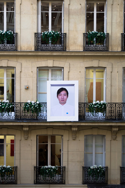 The facade of the building where the fair took place was adorned with POLIT-SHEER-FORM OFFICE’s Mr. Zheng (2007)—a composite portrait of the collective’s five members presented by BANK Gallery. All photos by Ned Carter Miles for ArtAsiaPacific.