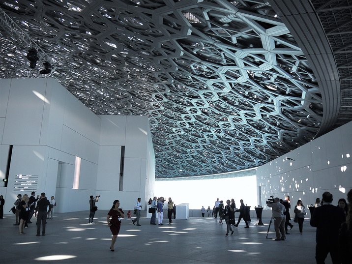 The 180-meter-diameter dome comprises eight layers of steel iron and aluminium cladding, separated by a steel frame five meters high, and reveals a complex pattern repeated in various scales and angles throughout the layers. When light shines through it, it creates an effect called the “rain of light.”