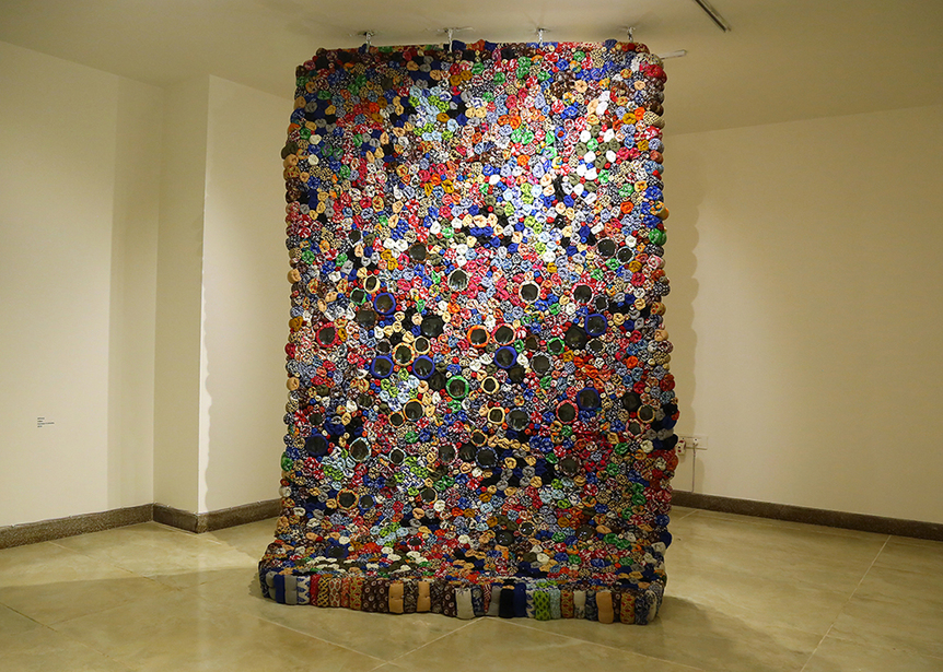 ANOLI PERERA, The Long Walk, 2018, fabric, cotton stuffing, PVC pipes, magnifying lenses and printed images, 274 × 182 × 13 cm. Courtesy Shrine Empire, New Delhi.