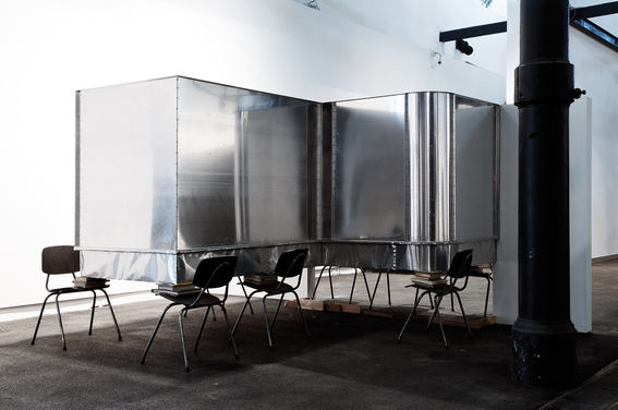 Installation view of MARK MANDERS’s Nocturnal City Scene, 1993, aluminum, sand, chairs, books, glass, rope, 3.5 × 2.9 × 2.0 m, at “Walking On The Fade Out Lines,” Rockbund Art Museum, Shanghai, 2018. Courtesy Sandretto Re Rebaudengo Collection.