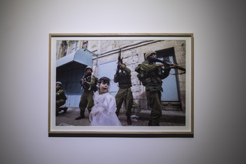 Installation view of PAVEL WOLBERG’s Hebron, 2004, C-print, 150 × 100 cm, at “On Struggling to Remain Present When You Want to Disappear,” OCAT Shanghai, 2018. Courtesy the artist and OCAT Shanghai.