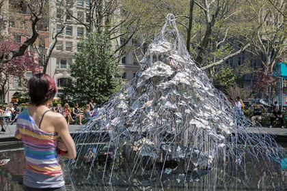 Installation view of DIANA AL-HADID’s Citadel, 2017–18, steel, polymer gypsum, fiberglass, paint, aluminum, and bronze, 6.4 × 5.5 × 4.1 m, at “Delirious Matter,” Madison Square Park, New York, 2018. Photo Rashmi Gill.