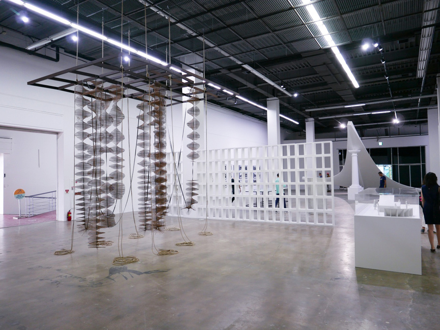 Interior of Clara Kim’s exhibition “Imagined Nations / Modern Utopias” with LEONOR ANTUNES’s hanging sculpture, A Secluded and Pleasant Land. In This Land I Wish to Dwell (2014), based on windows in Brazilian modernist architecture and the weaving of indigenous tribes.