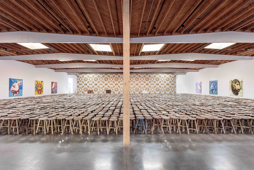 Installation view of AI WEIWEI’s Stools (center), 2013, 5,929 wooden stools, 21.8 × 21.6 × 0.5 m, at “Zodiac,” Jeffrey Deitch, Los Angeles, 2018. Photo by Joshua White. Courtesy Jeffrey Deitch.