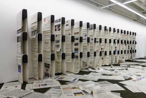 Installation view of CAMILLE HENROT’s Office of Unreplied Emails, 2016–17, digital prints on silicone, wooden racks and rubber floor covering, dimensions variable, at “Dissolving Margins,” Institute of Contemporary Arts Singapore, 2018–19. Photo by Weizhong Deng. Copyright the artist and König Galerie, Berlin.