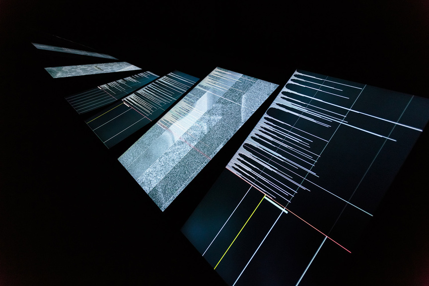 Installation view of RYOICHI KUROKAWA’s ad/ab Atom, 2017, audiovisual installation, seven-channel HD display, four-channel sound: 8 min (loop), at GNRation, Braga, 2017–18. Photo by Hugo Sousa. Copyright the artist. Courtesy GNRation, Braga.