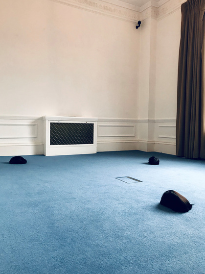 Partial installation view of SHUHEI YAMADA’s Untitled, 2019, sound installation, wigs, at “Untitled Yet,” Daiwa Anglo-Japanese Foundation, London, 2019.