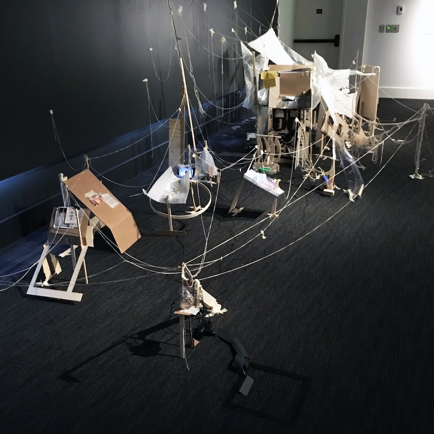 Installation view of SATPREET KAHLON’s In Between, 2018, found materials, video, audio, dimensions variable, at  “Lore Re-Imagined: Shadows of our Ancestors” at Wing Luke Museum of the Asian Pacific American Experience, Seattle, 2018–19. Courtesy Wing Luke Museum of the Asian Pacific American Experience.