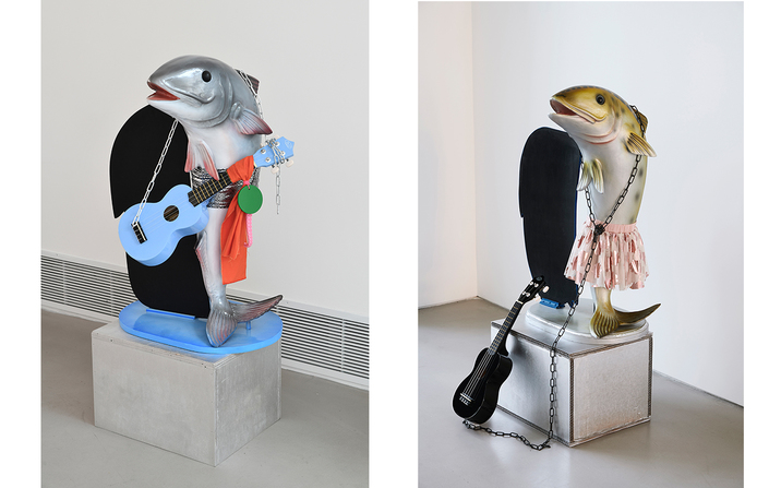 COSIMA VON BONIN, What If It Barks 5 (Petite Version with Blue Ukulele) (left), 2018, plastic, fabric, wood pedestal, ukulele, chain and rubber, 
106.7 × 61 × 45.7 cm, and What If It Barks 6 (Petite Version with Black Ukulele) (right), 2018, plastic, fabric, wood, cardboard pedestal, chain and ukulele, 109.2 × 58.4 × 50.8 cm.