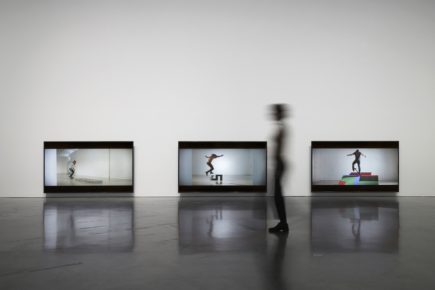 Installation view of SHAUN GLADWELL’s Skateboarders vs. Minimalism, 2016, still from three-channel video, high definition, with color and sound: 8 min 6 sec, 18 min 2 sec, 27 min 2 sec, at “Pacific Undertow,” Museum of Contemporary Art Australia (MCA), Sydney, 2019. Photo by Zan Wimberley. Copyright the artist. Courtesy MCA.