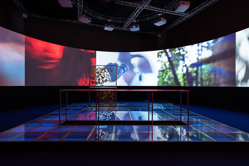 TING CHAONG-WEN, Virgin Land, 2019, tempered glass floor, ultraviolet light tube, neon lamp, raw material of the cinchona tree, tonic water, multi-channel video, dimensions variable. Commissioned by the 2019 Asian Art Biennial. Courtesy Asian Art Biennial, Taichung.