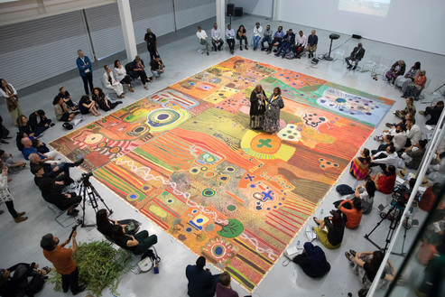 Installation view of Ngurrara Canvas II created by 40 Indigenous artists in Australia, 1997, oil on canvas, 10 × 8 m, at “Rights of Future Generations,” Sharjah Architecture Triennial, 2019. Image via Twitter.