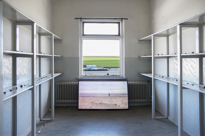 Installation view of TIANYI ZHENG’s Nothing Exercise, 2020–21, bricks, kite, plastic bag, analogue photography, lightbox, site-specific performance, videos, dimensions variable, at Bierumer School, Bierum, 2021.